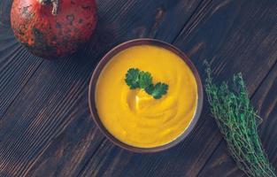 Bowl of pumpkin soup photo