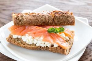 Sandwich with salmon and cheese photo