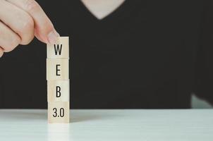 Wooden cubes with WEB 3.0 symbol on background and copy space.Business concepts. photo