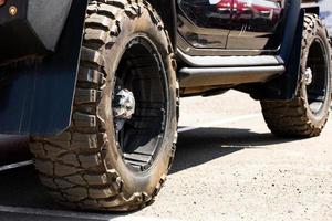 Car off-road rear view on large wheels. photo