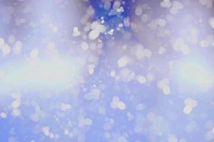 abstract natural light blue winter christmas sky heavy white snowflakes falling shining beautiful snow on sky white. photo