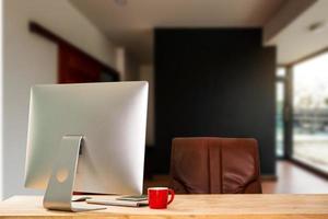 workspace with computer, laptop, office supplies, and coffee cup, smartphone, and tablet at office. desk work concept. photo