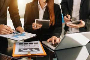 Business team meeting. professional investor working new start up project. Finance task. with smart phone and laptop and digital tablet computer photo