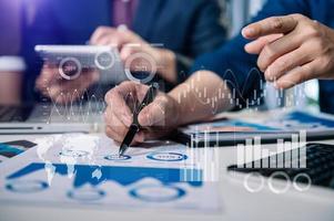 Investor analyzing stock market report and financial dashboard with business intelligence , with key performance indicatorsBusiness team meeting. photo