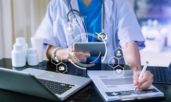 Medicine doctor and stethoscope using tablet with icon medical network connection on virtual photo