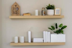 Stylish scandi interior with books and flower. photo