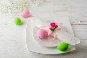 Pink and green Easter table place setting photo