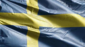 sveriges textilflagga vajar långsamt på vindslingan. svensk banderoll svajar smidigt på vinden. tyg textilvävnad. full fyllning bakgrund. 20 sekunders loop.