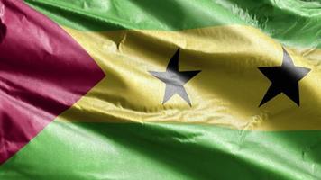 Sao Tome and Principe textile flag slow waving on the wind loop.  Fabric textile tissue. Full filling background. 20 seconds loop. video