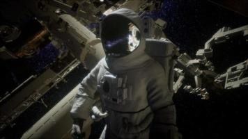 Astronaut outside the International Space Station on a spacewalk video