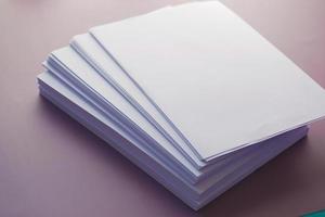 close up of stack of empty paper on table photo