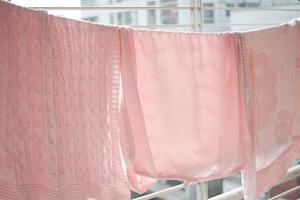 child clothes line filled with hanging trousers photo