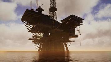 Offshore Jack Up Rig in The Middle of The Sea at Sunset Time video