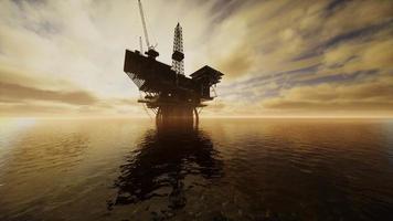 Offshore Jack Up Rig in The Middle of The Sea at Sunset Time video