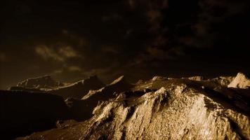 Dark clouds over volcanic valley with grass and rocks video