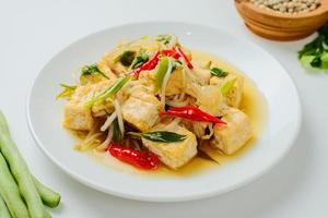 Indonesian stir fry bean sprouts mixed with fried tofu photo