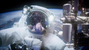 Astronaut at spacewalk. Elements of this image furnished by NASA video