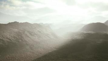 aerial vulcanic desert landscape with rays of light video