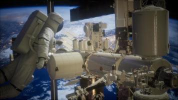 International Space Station and astronaut in outer space over the planet Earth video