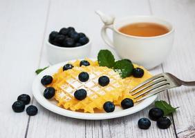 Waffles with blueberries photo