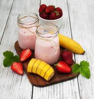 yogurt with fresh strawberries and banana photo