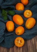 Kumquats on a textile napkins photo