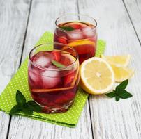 Glasses of lemonade with strawberries photo