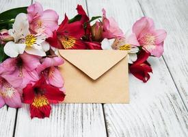 paper envelope with alstroemeria flowers photo