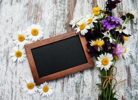 Wild flowers with blackboard photo