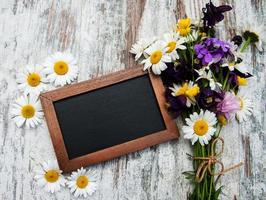 Wild flowers with blackboard photo