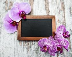 Blackboard and orchids photo