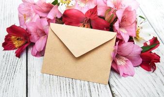 paper envelope with alstroemeria flowers photo