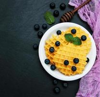 Waffles with blueberries photo