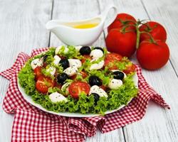 salad with mozarella cheese and vegetables photo