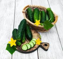 Fresh cucumbers on a table photo