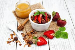 Homemade granola with strawberries photo