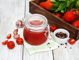 Jar with tomato sauce photo