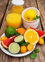 Juice and fresh citrus fruits photo
