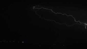 Lightning strike in black night sky video