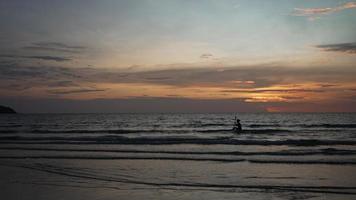 Silhouette of Adult Person Kayaking in Sea at Sunset video