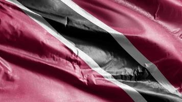 Trinidad and Tobago textile flag waving on the wind loop. Trinidad and Tobago banner swaying on the breeze. Fabric textile tissue. Full filling background. 10 seconds loop. video