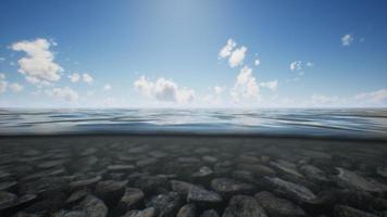 ocean seascape with sky and ocean wave splitted by waterline to underwater part video