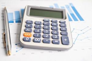 Calculator on graph paper. Finance development, Banking Account, Statistics, Investment Analytic research data economy, Stock exchange trading, Business company concept. photo