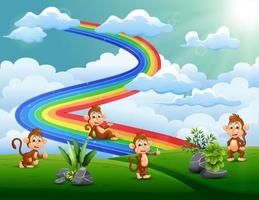 un grupo de monos en la cima de la colina con un arco iris vector
