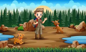 Happy boy with two dogs beside small pond vector