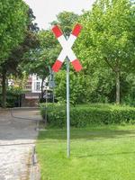 Train level crossing sign photo