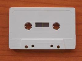 Tape cassette on wooden desktop photo