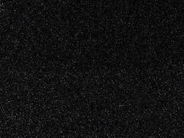 Dark black background with shiny speckles photo