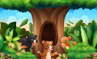 A different bears under the hollow tree background vector