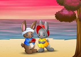 Romantic of loving rabbit couple on the beach vector